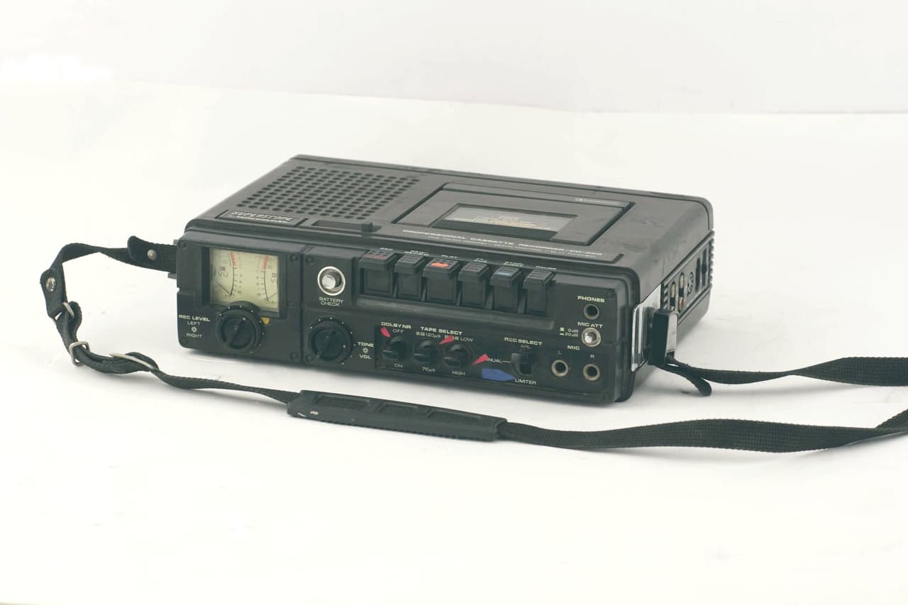 Vintage cassette recorder, representing field audio recording